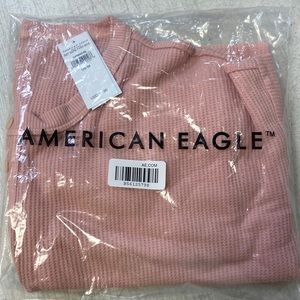 Never worn. Long sleeve crop top. Size M